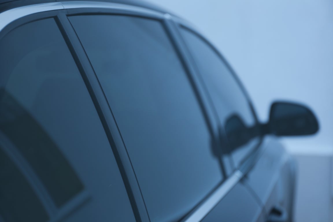 Modern Car with Tinting Foil on Window, Closeup